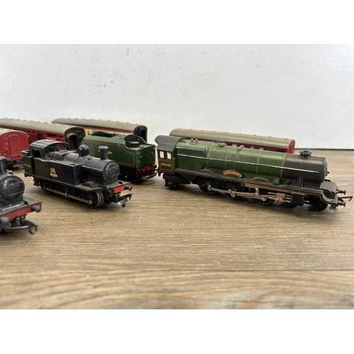 415 - Four boxes containing a large collection of mainly Tri-ang model railway accessories to include Brit... 