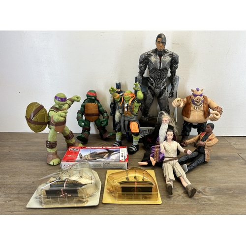 420 - A collection of TV and film related action figurines to include DC Justice League Sidebork, Viacom I... 