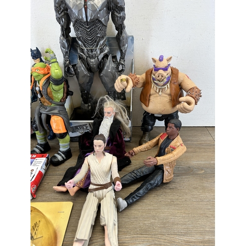 420 - A collection of TV and film related action figurines to include DC Justice League Sidebork, Viacom I... 