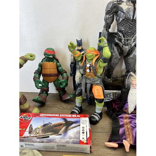 420 - A collection of TV and film related action figurines to include DC Justice League Sidebork, Viacom I... 