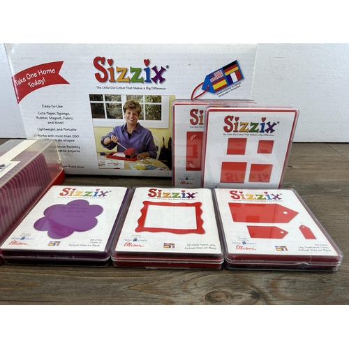 422 - A collection of boxed and cased Sizzix die-cutter and accessories