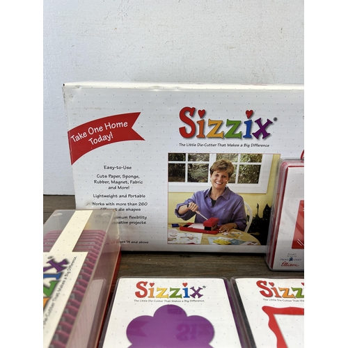 422 - A collection of boxed and cased Sizzix die-cutter and accessories