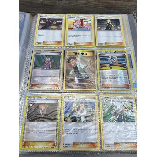 423 - A large collection of Pokémon trading cards to include two Jumbo cards, GX, EX and V cards, various ... 