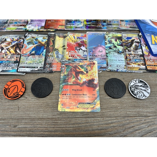 423 - A large collection of Pokémon trading cards to include two Jumbo cards, GX, EX and V cards, various ... 