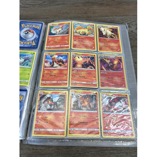 423 - A large collection of Pokémon trading cards to include two Jumbo cards, GX, EX and V cards, various ... 