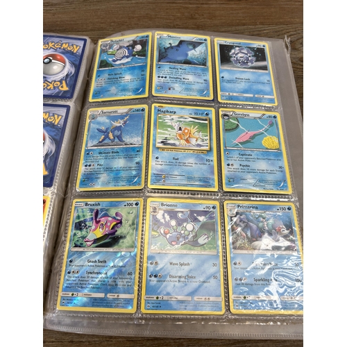 423 - A large collection of Pokémon trading cards to include two Jumbo cards, GX, EX and V cards, various ... 