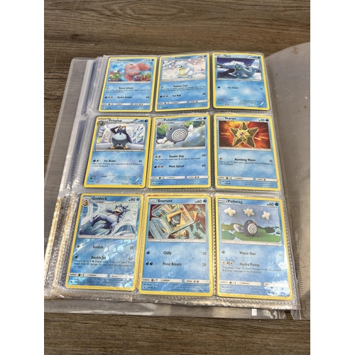 423 - A large collection of Pokémon trading cards to include two Jumbo cards, GX, EX and V cards, various ... 