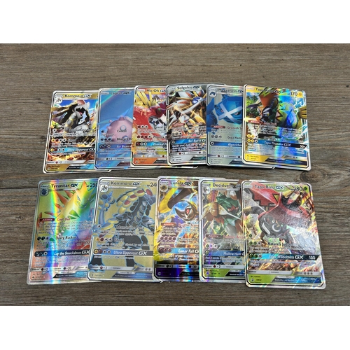 423 - A large collection of Pokémon trading cards to include two Jumbo cards, GX, EX and V cards, various ... 