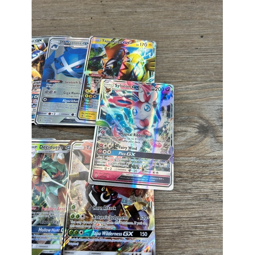 423 - A large collection of Pokémon trading cards to include two Jumbo cards, GX, EX and V cards, various ... 