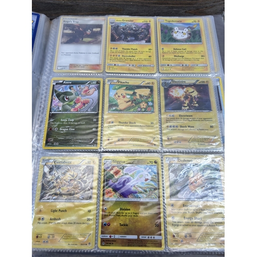 423 - A large collection of Pokémon trading cards to include two Jumbo cards, GX, EX and V cards, various ... 