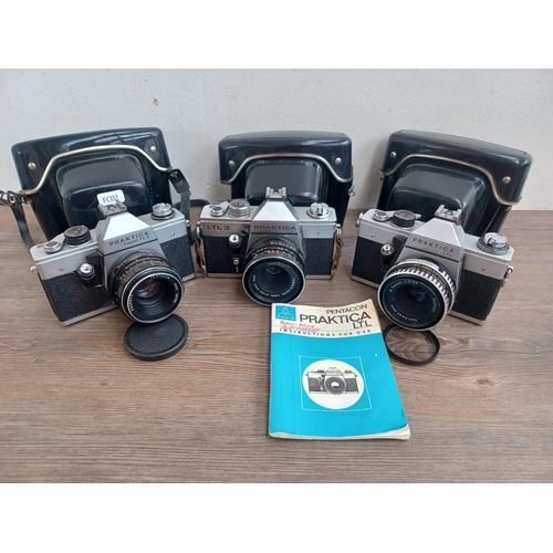 Three cased Pentacon Praktica 35mm SLR cameras, one Super TL2