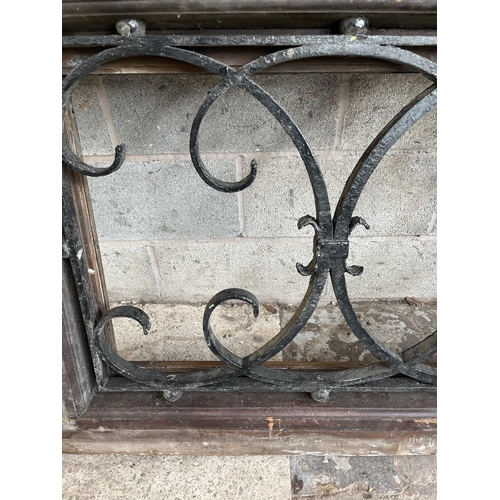 1 - A 19th century wooden and cast iron ecclesiastical window - approx. 95cm high x 167cm wide