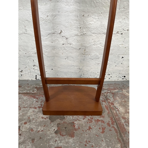 10 - A Qcesorib cherry wood valet stand