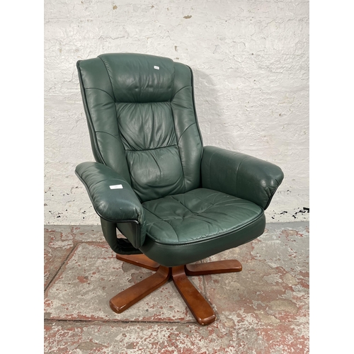 100 - A Stressless style green leather swivel reclining armchair