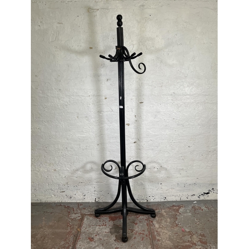 15 - A black painted bentwood coat stand