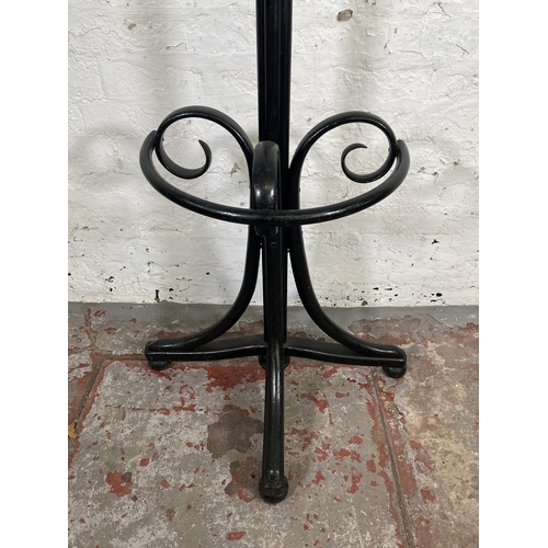 15 - A black painted bentwood coat stand