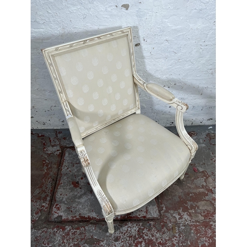 17 - A Louis XVI style white painted and fabric upholstered armchair