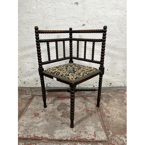 18 - A 19th century bobbin turned and tapestry upholstered corner chair