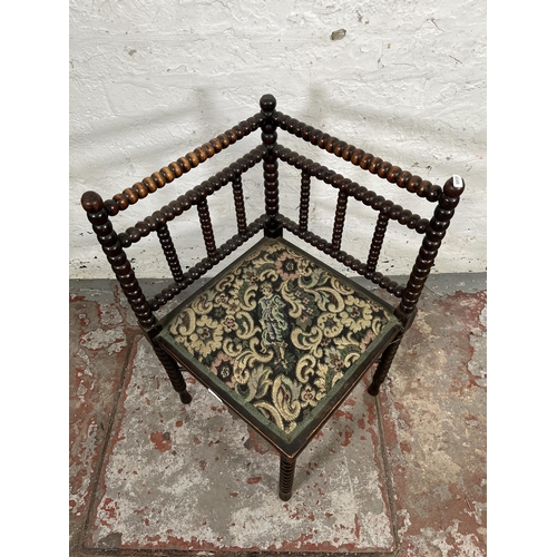 18 - A 19th century bobbin turned and tapestry upholstered corner chair