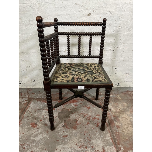 18 - A 19th century bobbin turned and tapestry upholstered corner chair