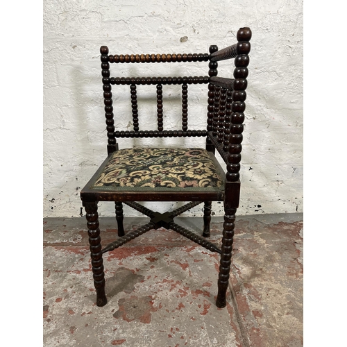 18 - A 19th century bobbin turned and tapestry upholstered corner chair