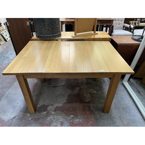 19 - A modern solid oak rectangular extending dining table - approx. 75cm high x 90cm wide x 130cm long n... 