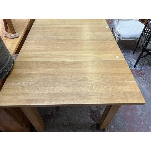 19 - A modern solid oak rectangular extending dining table - approx. 75cm high x 90cm wide x 130cm long n... 