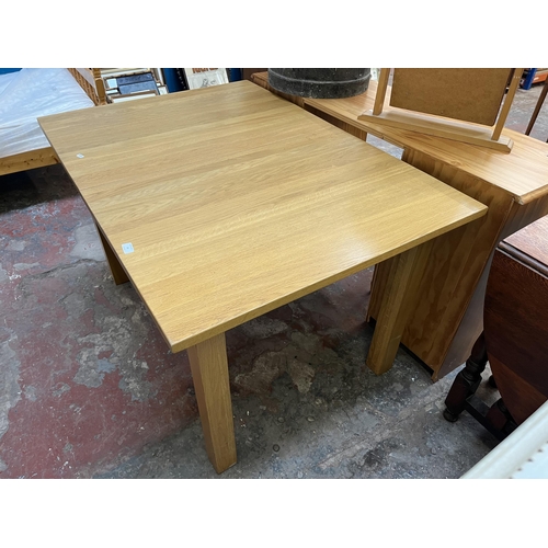 19 - A modern solid oak rectangular extending dining table - approx. 75cm high x 90cm wide x 130cm long n... 