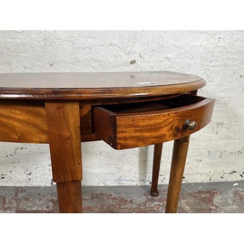 21 - A Georgian style mahogany half moon console table with single drawer