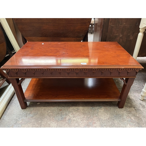 22 - A yew wood rectangular two tier coffee table