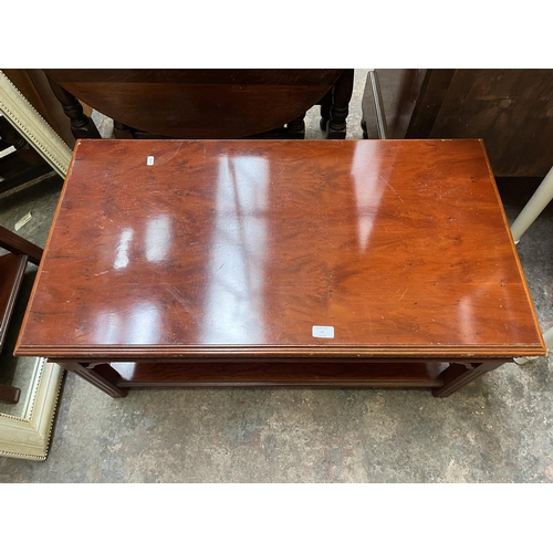 22 - A yew wood rectangular two tier coffee table