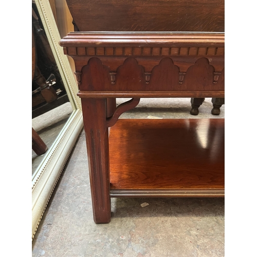 22 - A yew wood rectangular two tier coffee table