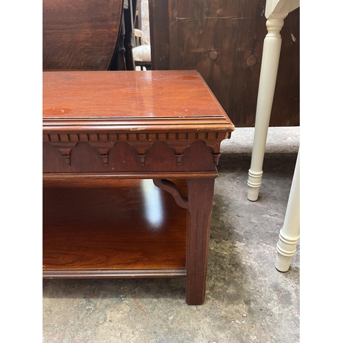 22 - A yew wood rectangular two tier coffee table