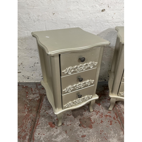 28 - A pair of French style silver painted bedside chests of three drawers