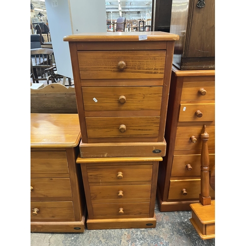 31 - A pair of Ameta Kauri Country bedside chests of three drawers