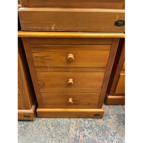 31 - A pair of Ameta Kauri Country bedside chests of three drawers