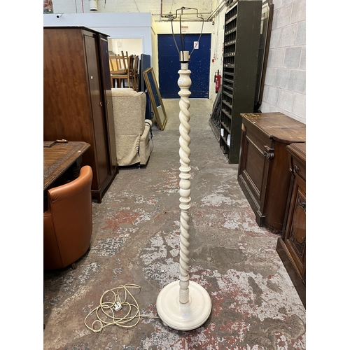 36 - A white painted barley twist standard lamp - approx. 154cm high