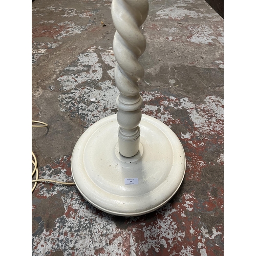 36 - A white painted barley twist standard lamp - approx. 154cm high