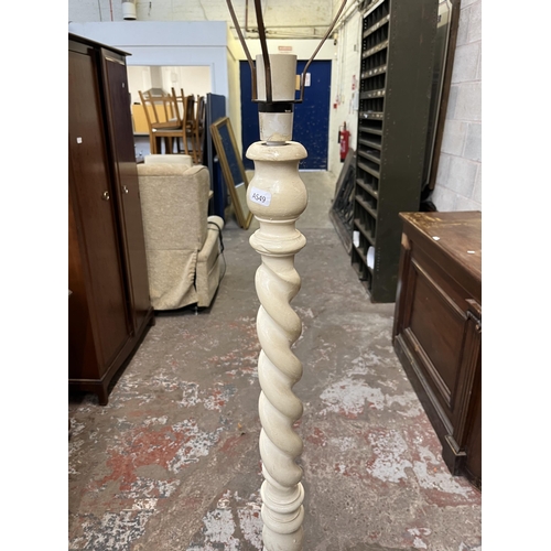 36 - A white painted barley twist standard lamp - approx. 154cm high