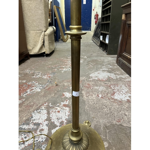 37 - A 19th century style brass tri-footed standard lamp - approx. 152cm high