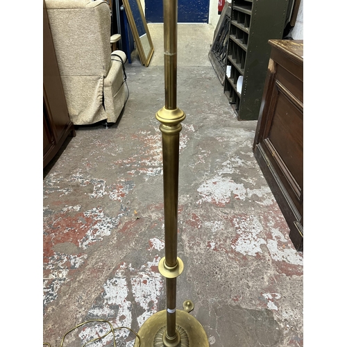 37 - A 19th century style brass tri-footed standard lamp - approx. 152cm high