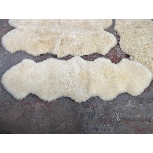 38 - Three sheepskin rugs to include Dunelm 170cm x 60cm etc.