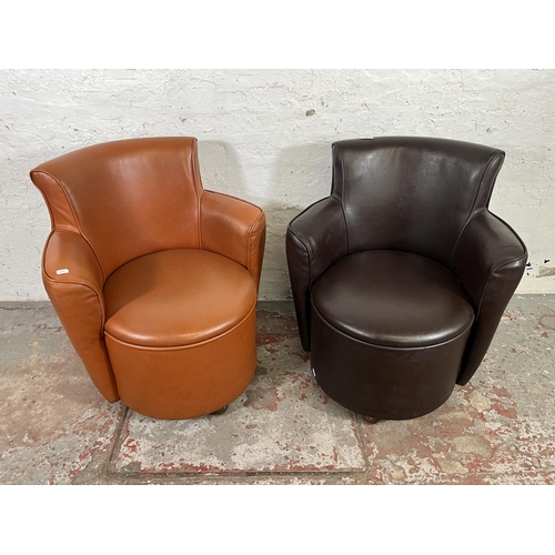 39 - Two modern leatherette tub chairs