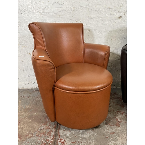 39 - Two modern leatherette tub chairs