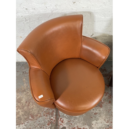 39 - Two modern leatherette tub chairs