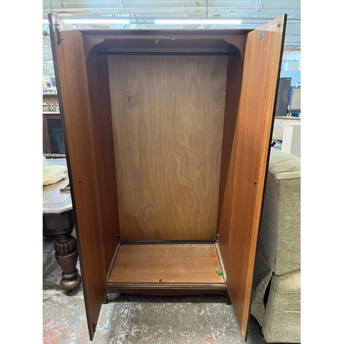 40 - A Stag Minstrel mahogany double wardrobe