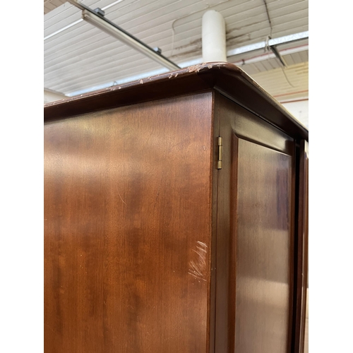 40 - A Stag Minstrel mahogany double wardrobe