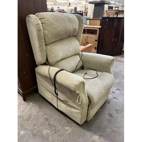 40B - A modern fabric upholstered electric reclining armchair with remote and power supply