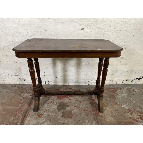 42 - A Victorian Aesthetic Movement mahogany side table with lower stretcher