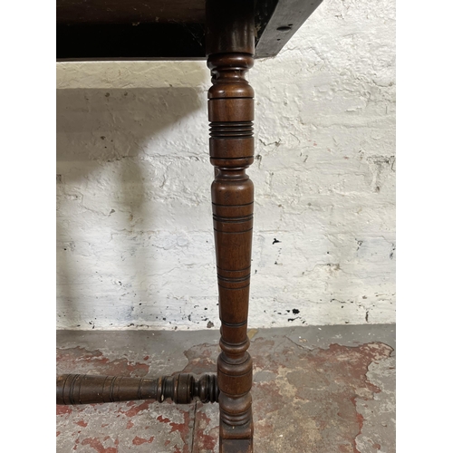 42 - A Victorian Aesthetic Movement mahogany side table with lower stretcher